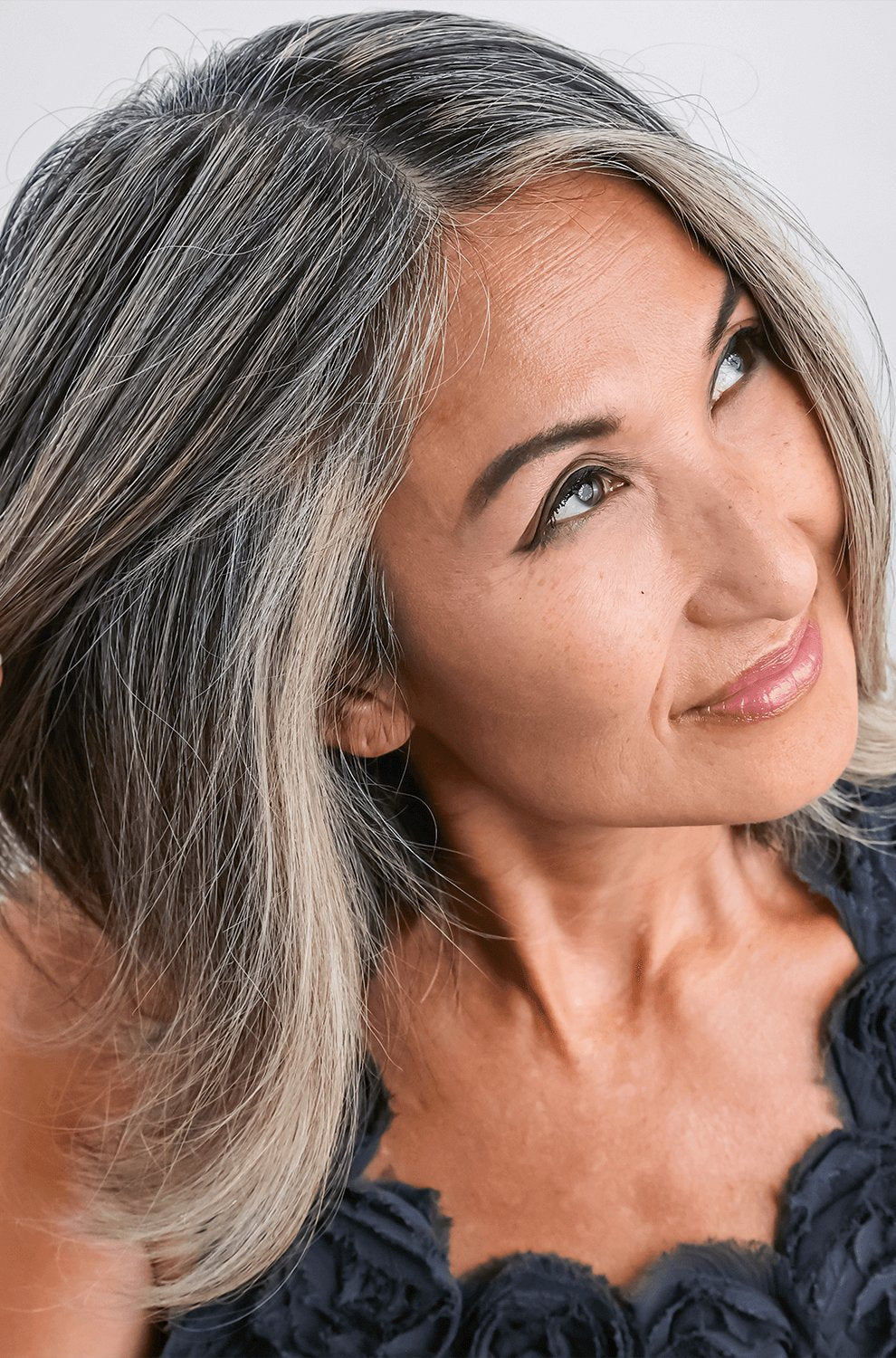 woman with chin-length gray hair that is smooth and plump