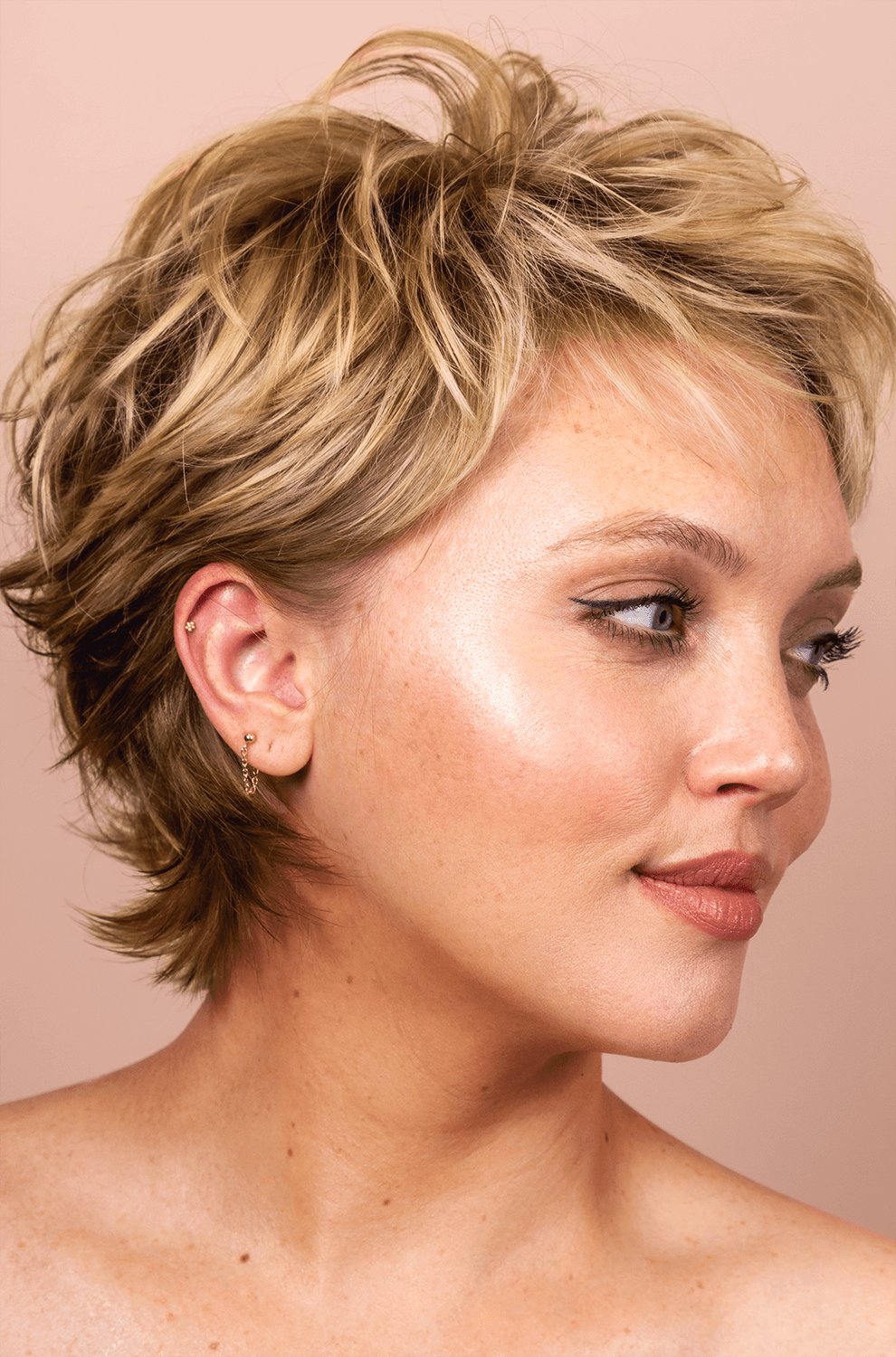 woman with a pixie haircut with textured, volumized layers