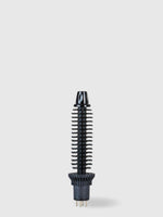 The Calista Tools Perfecter Pro Swap Top 0.50" Brush Head, a black cylindrical attachment with plastic bristles, stands upright against a plain light gray background.