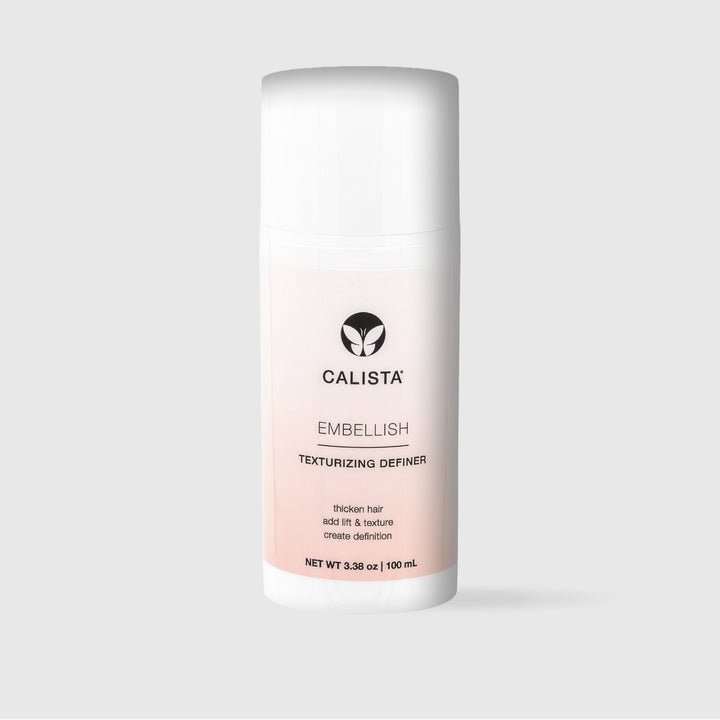 A white bottle of Calista Tools EMBELLISH Texturizing Definer Large, 3.38 oz (100 mL), featuring a black logo and text, stands upright against a plain light gray background.