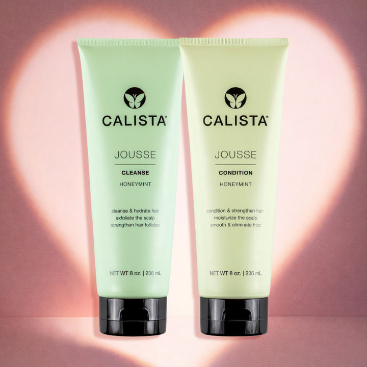 The JOUSSE Cleanse & Condition Duo by Calista Tools stands side by side before a glowing heart-shaped light on a pink background, promising scalp cleansing and nourishing hair hydration.