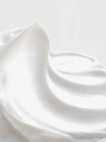 Close-up of Calista Tools STRATOSPHERE Bounce Cream, featuring smooth, white cream with soft peaks and gentle swirls that highlight its voluminizing effect against a light background.