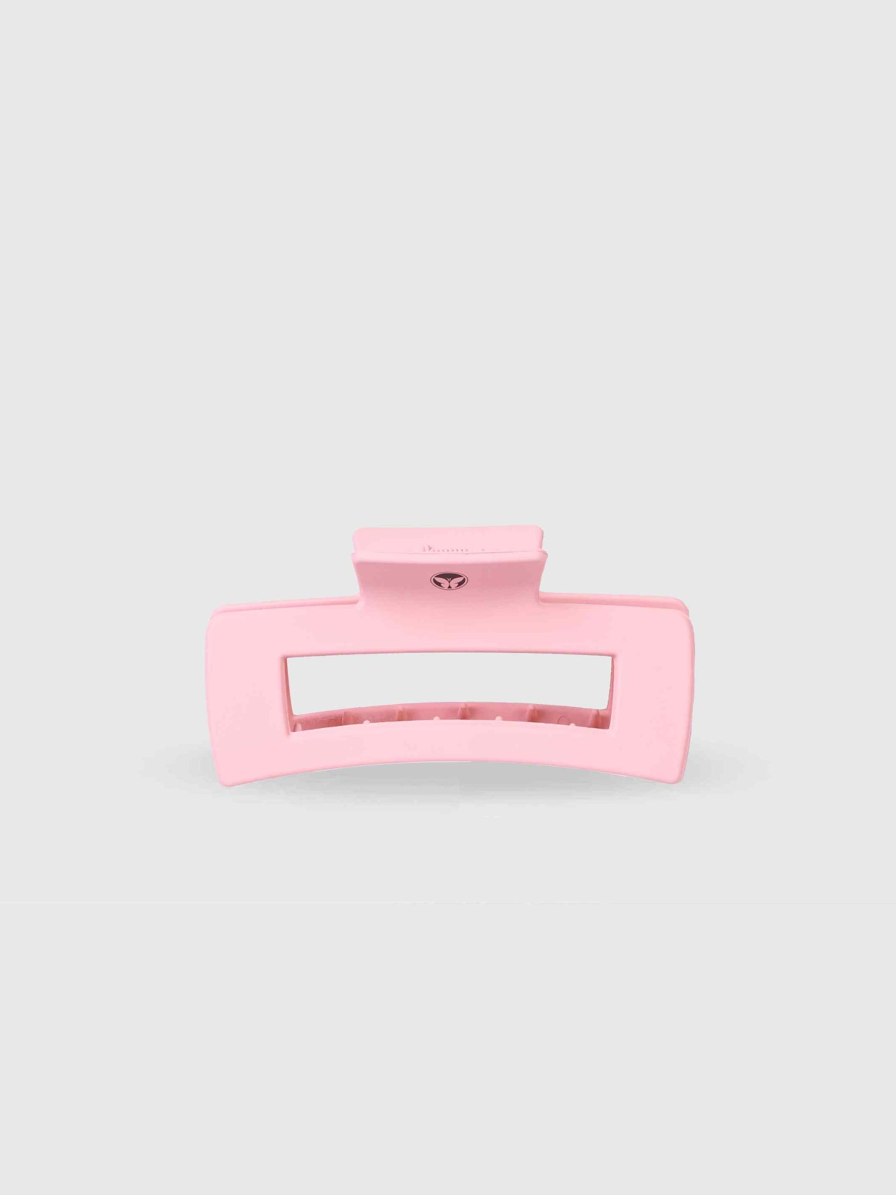 The Calista Claw Clip by Calista Tools is a large, light pink rectangular hair clip with a matte finish and wide teeth for a strong hold, shown against a plain light gray background.