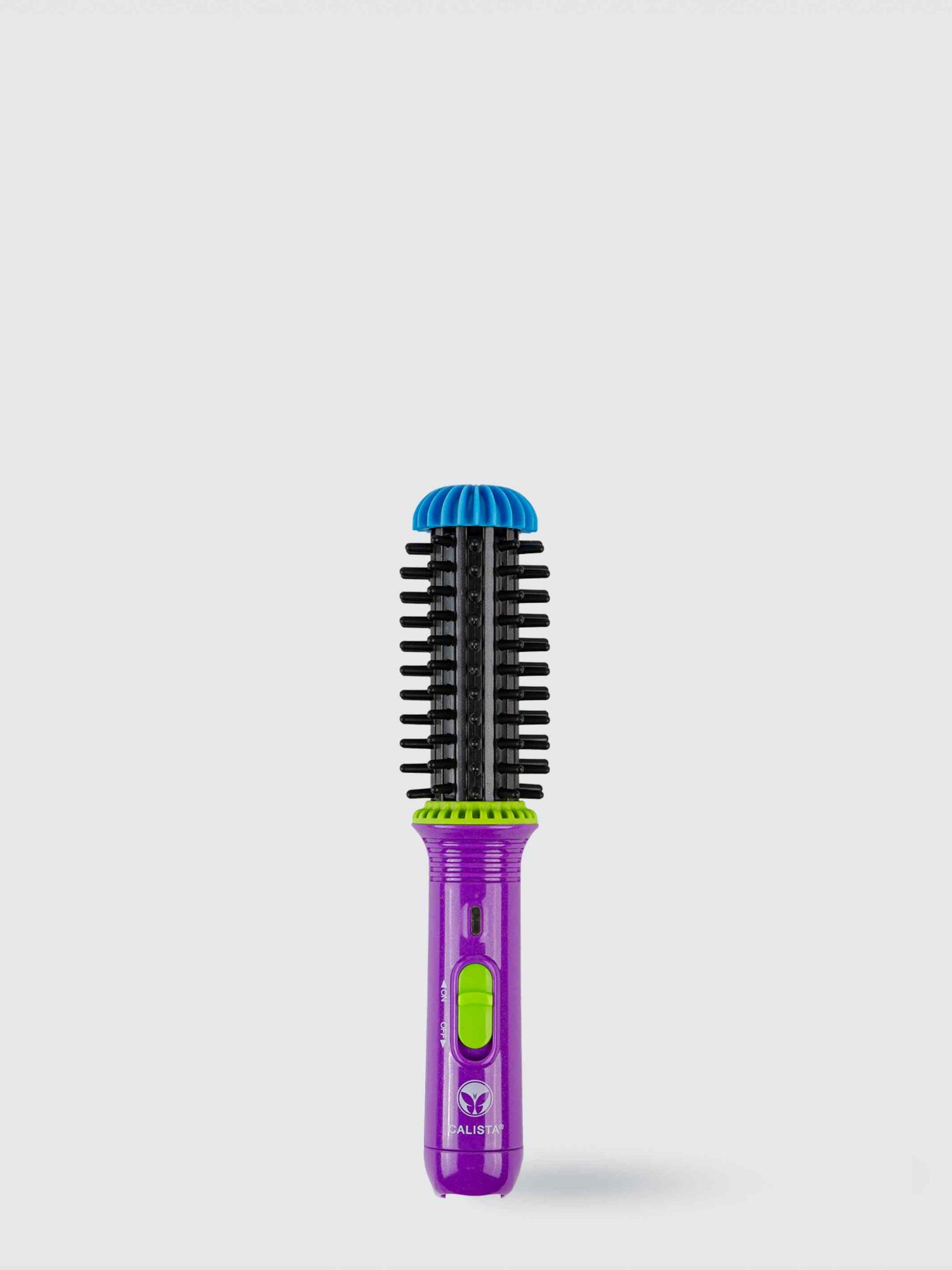 The Refurbished GoGo Mini Round Brush by Calista Tools features a purple and green handle, black bristles, and a blue protective cap—perfect for de-frizzing and volumizing hair—standing upright against a light gray background.