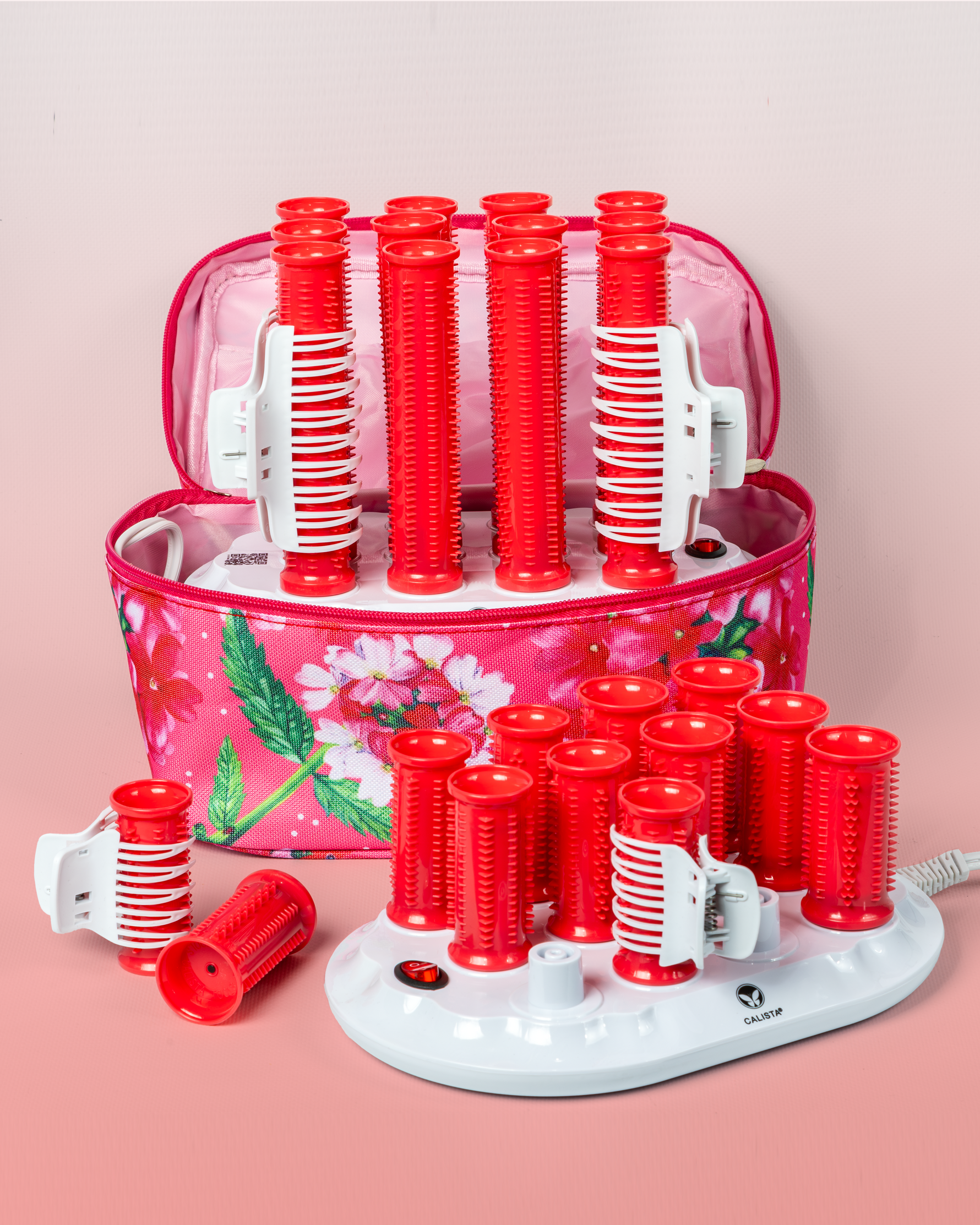 The Calista Tools Ion Hot Rollers Short Set - Gen 1 is shown with a floral pink carrying case and white heating base—ideal for creating hair volume using these gentle ionic rollers.