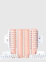 Four peach-colored Calista Tools Ion Hot Rollers Replacement Pack Long with bristles, featuring Ionic Technology for volume, are arranged vertically and flanked by four white clips—two on each side—on a light gray background.