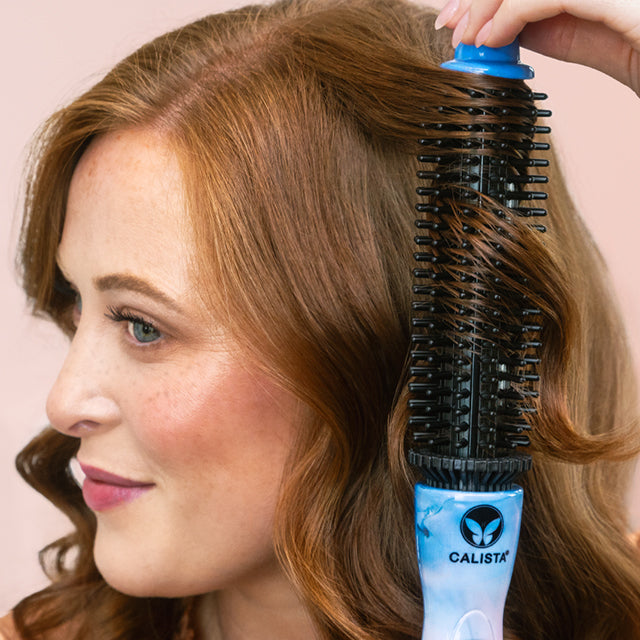 Maddie using the perfecter pro to curl her red hair