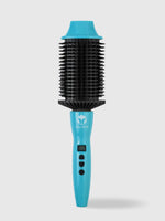 A turquoise Refurbished Perfecter Oval Heated Volumizing Brush by Calista Tools, featuring black bristles and control buttons on the handle, stands upright against a plain light background for effortless styling.