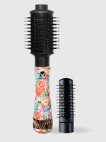 The Calista Tools Refurbished StyleDryer Pro Hair Drying Brush, featuring a floral handle and detachable barrel, stands upright on a light gray background, delivering salon-quality styling.