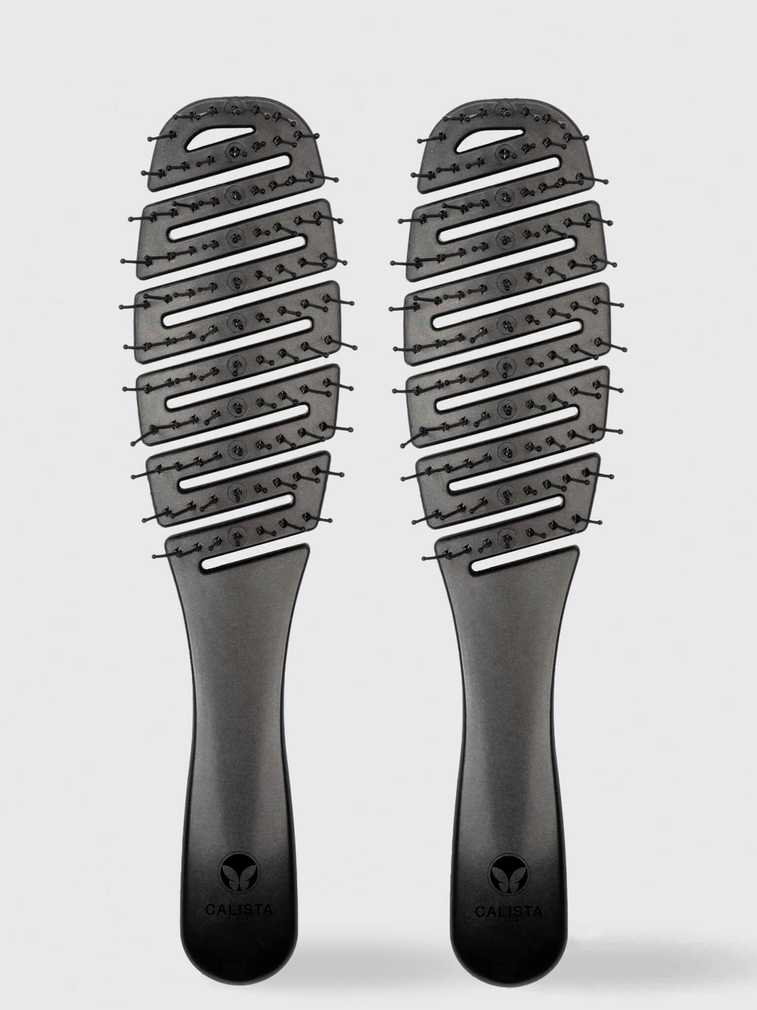 Two identical Calista Tools SMOOTHIE Brush Duo hair styling brushes with widely spaced, curved bristles are side by side on a light gray background, each displaying the Calista logo near the handle's base.