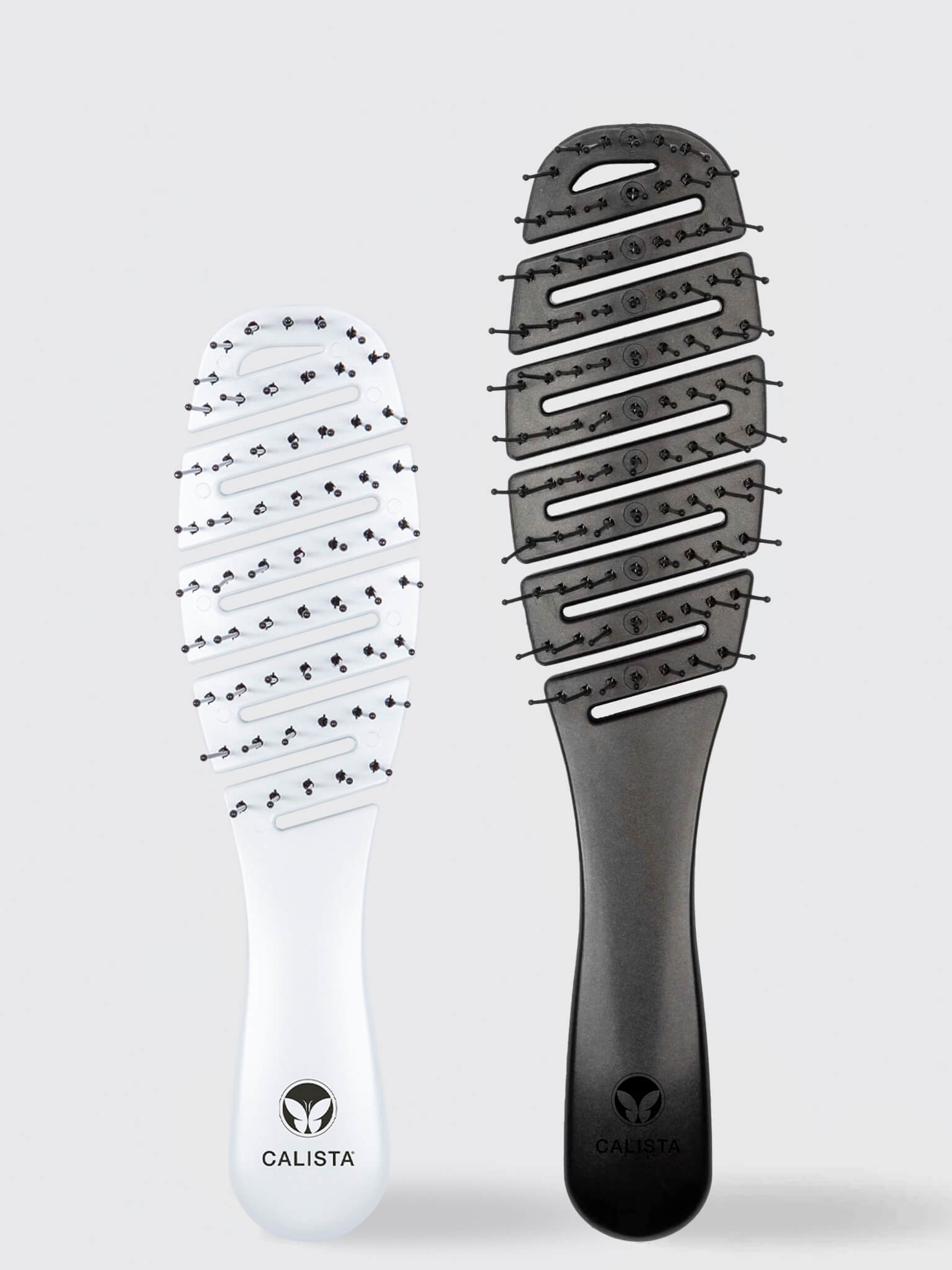 The SMOOTHIE Original + Mini Duo by Calista Tools features a white and a black vented paddle brush with branded handles, shown side by side on a light gray background. 