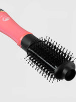 A close-up of the Calista Tools Vault StyleDryer Pro Hair Drying Brush - Long 2.75" shows its pink and black cylindrical barrel, vented section for optimal airflow, and bristles designed for volumizing and styling hair.