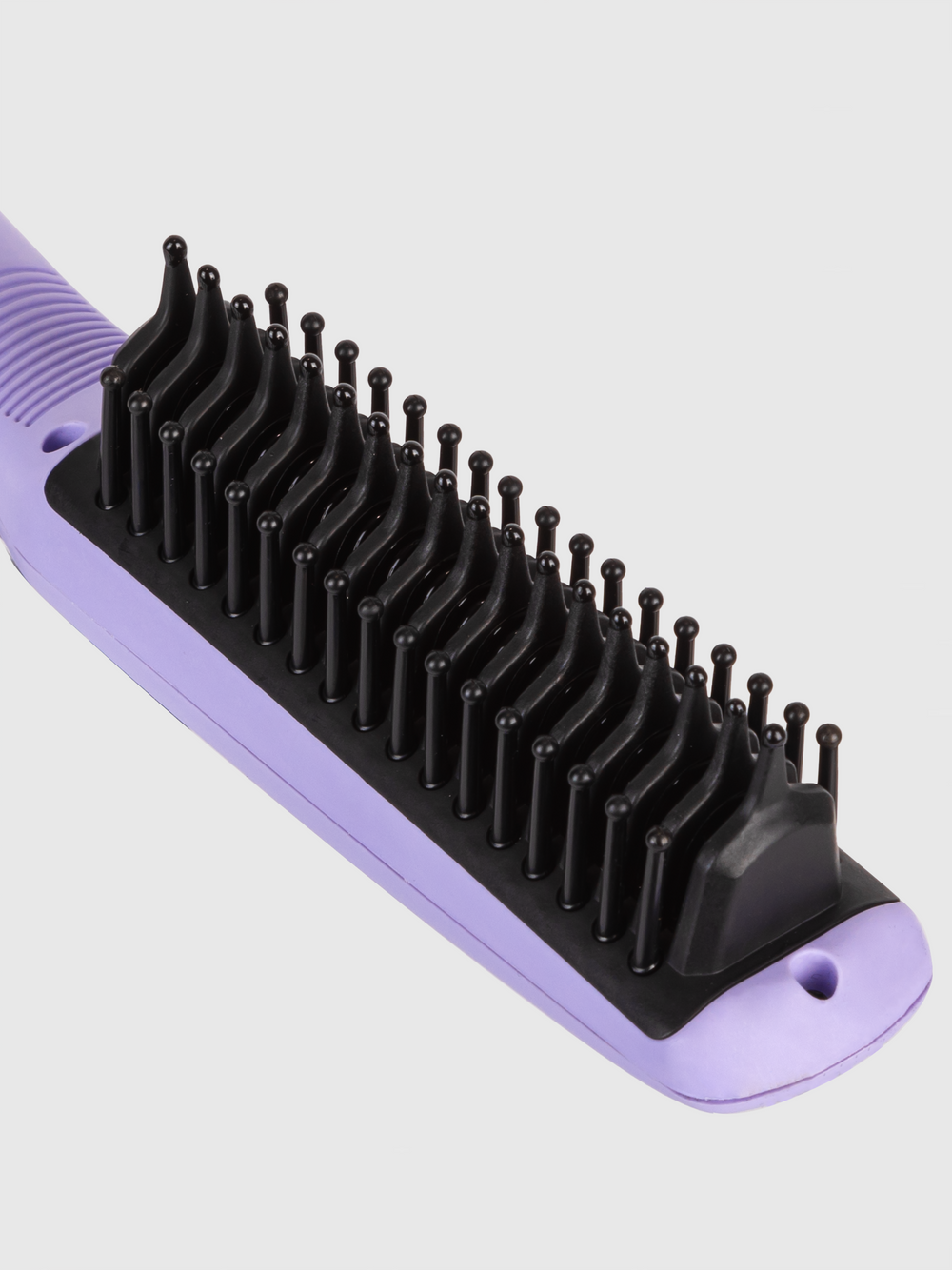 A close-up of the Calista Tools Vault Triangl Pro Heated Detailer Brush, featuring purple and black accents with plastic bristles, shown against a white background—ideal for de-frizzing hair and adding shine.