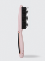The Calista Tools Vault Triangl Pro Heated Detailer Brush, shown upright with black bristles on a pink body against a white background, is ideal for de-frizzing hair and adding smoothness.
