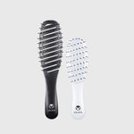 Two Calista Smoothie hairbrushes on a light gray background, an original size in black and a mini in white, showing both sides of the product.