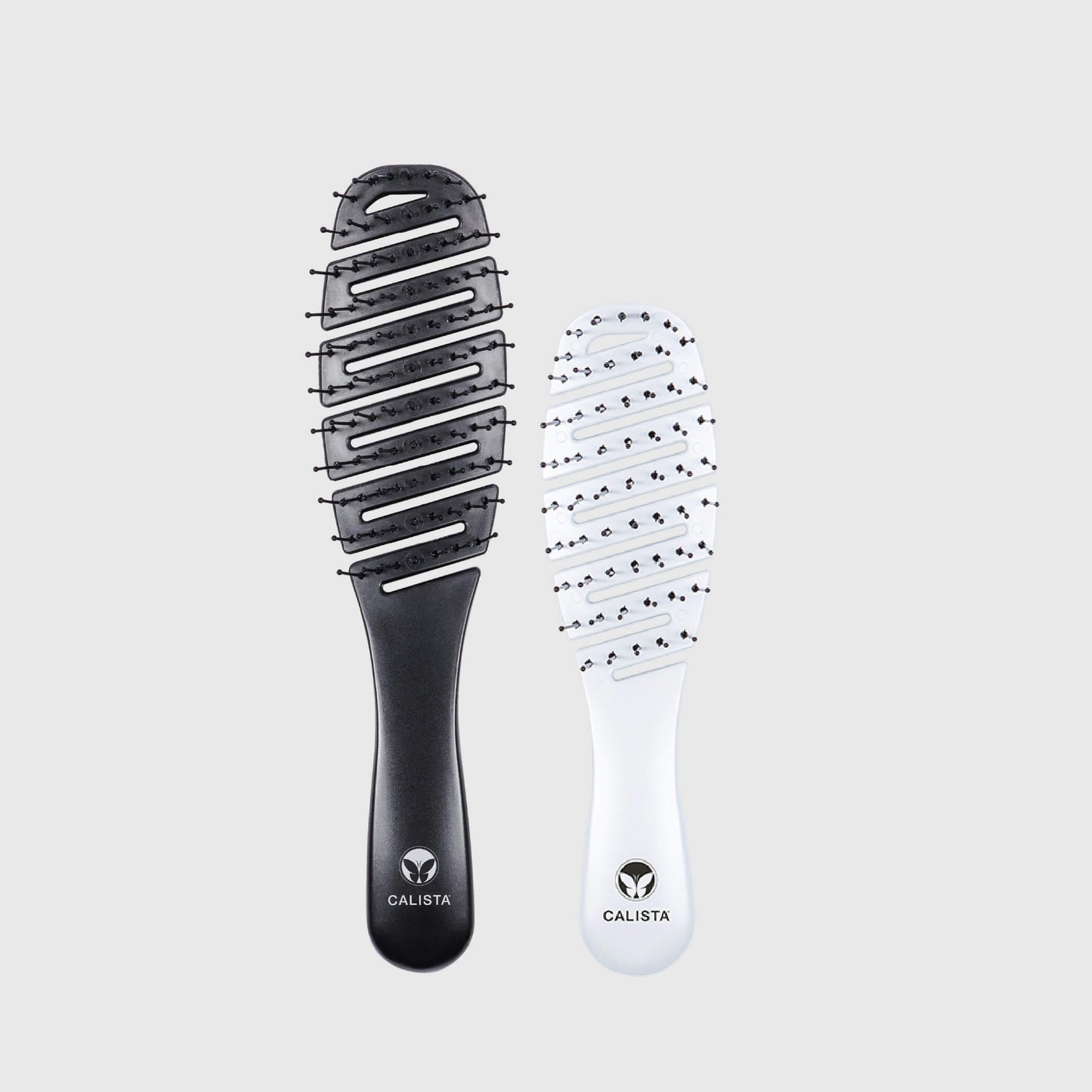 Two Calista Smoothie hairbrushes on a light gray background, an original size in black and a mini in white, showing both sides of the product.