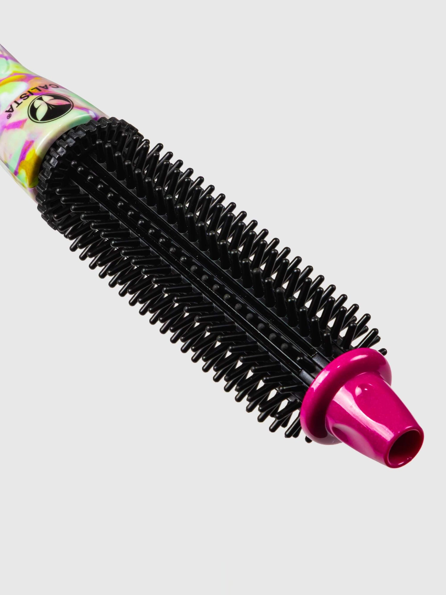A close-up of the Perfecter Pro Heated Round Brush 1" Pro + with black bristles, a vibrant handle, and a shiny pink tip, set against a light gray background.
