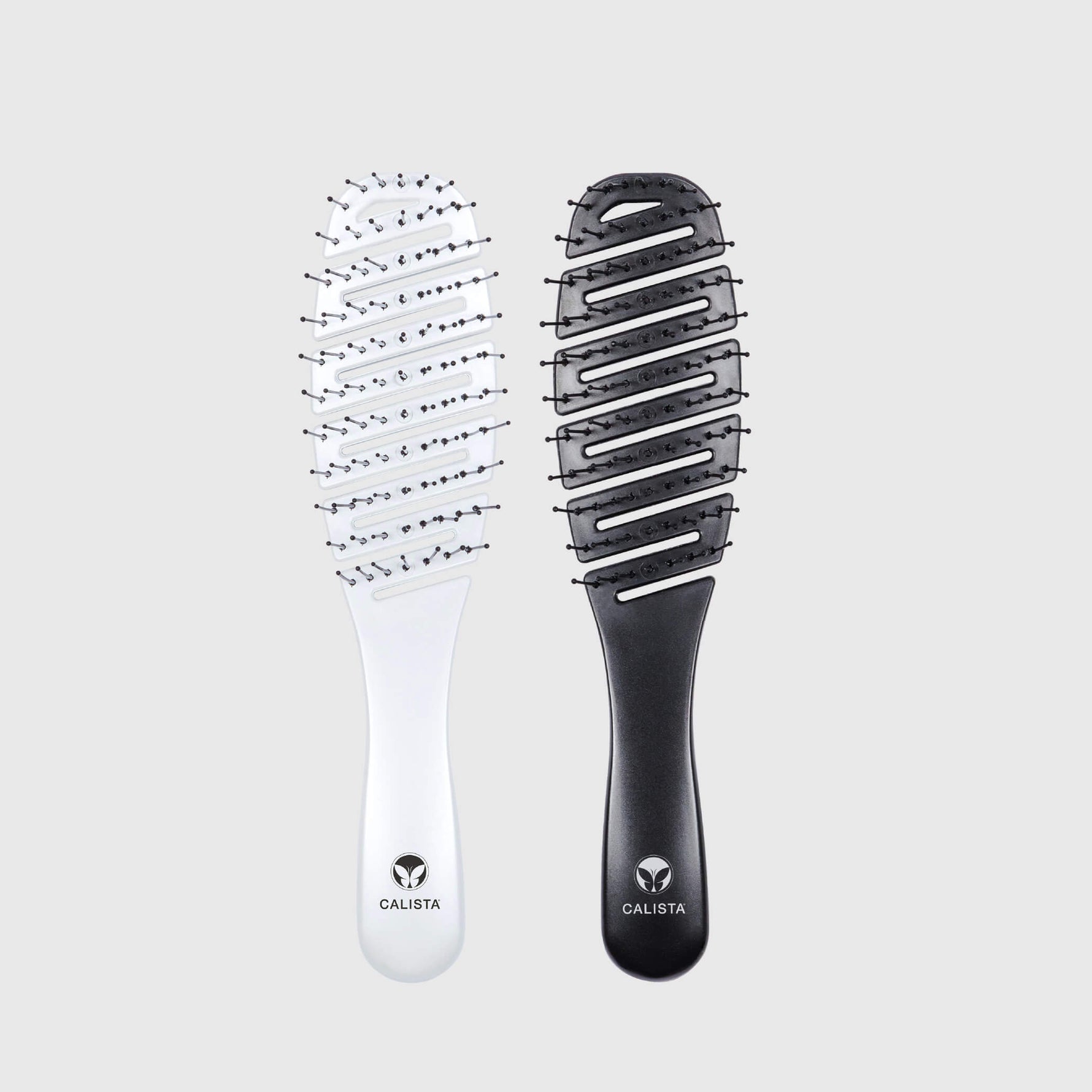 two calista smoothie brushes, one white and one black